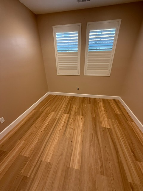 Room after luxury vinyl plank flooring, baseboards and interior painting